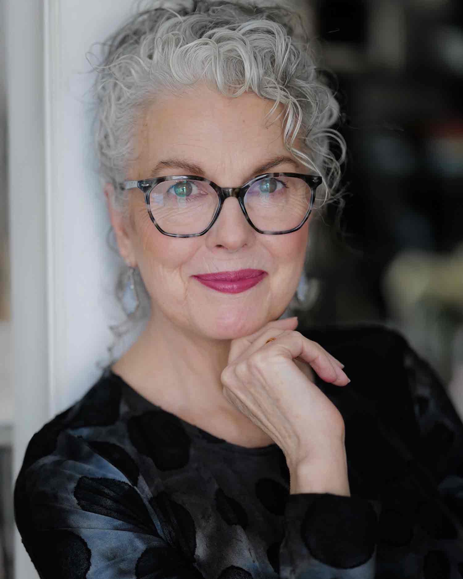 Kerry-Lou Henson, silver hair expert and founder of Silver Style Studio with glasses