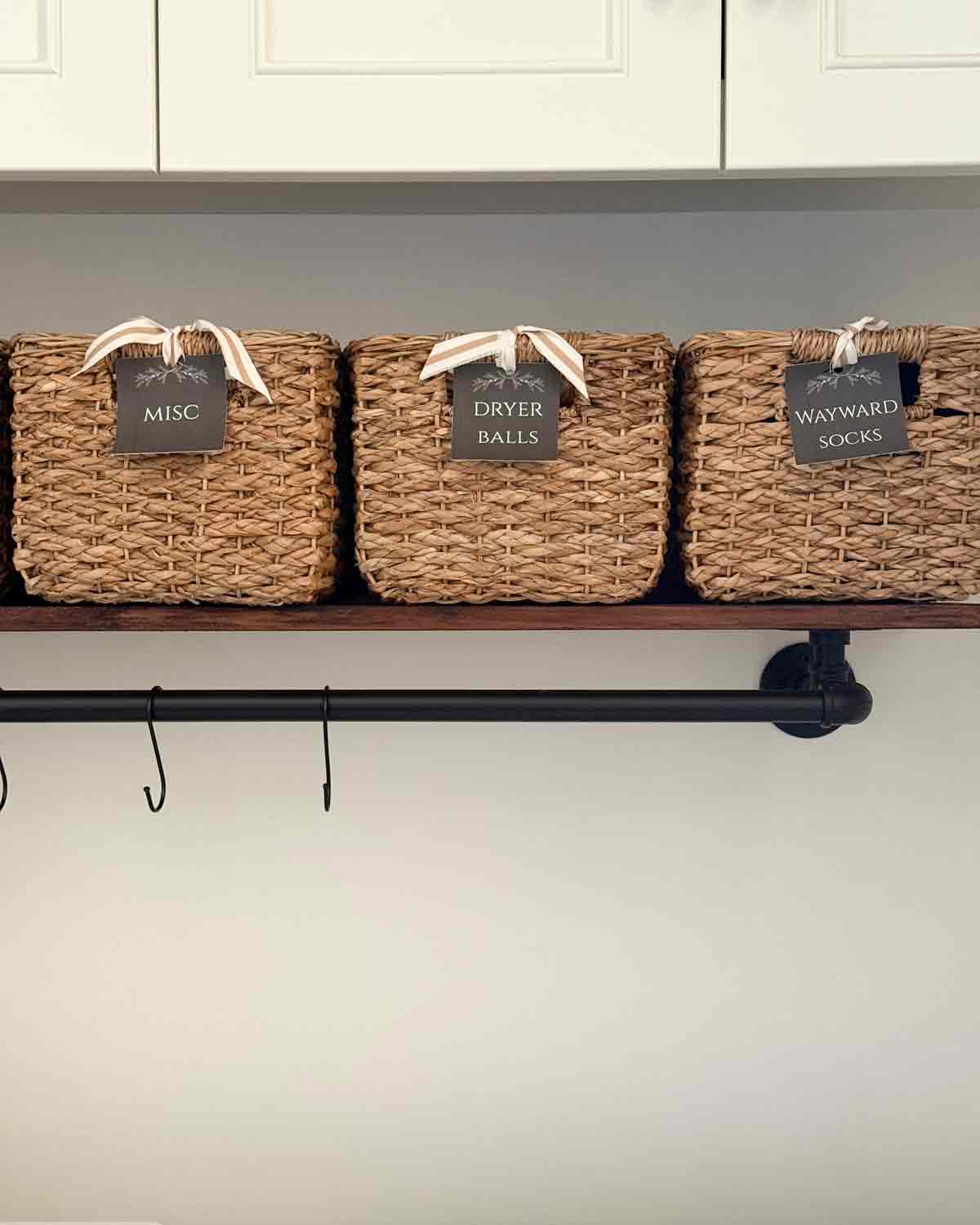 basket and floating shelf storage in laundry room