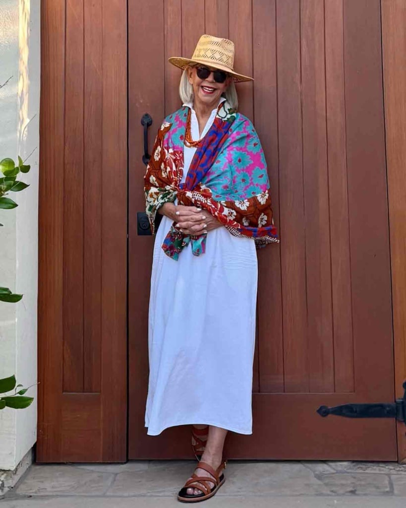 one dress styled for dinner with colorful scarf and vintage necklace