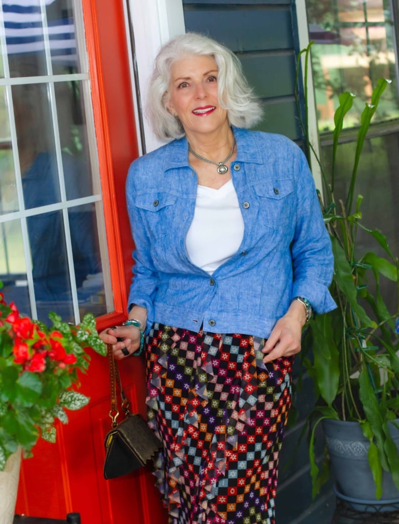 Kelli Enlow in Jean shirt and colorful skirt